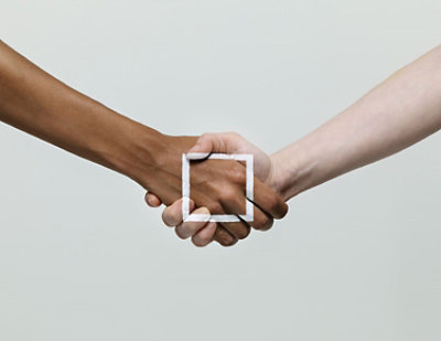 A close-up of hands shaking.