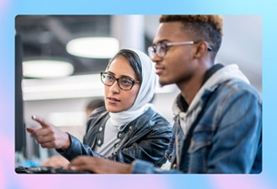 A person and person looking at a computer
