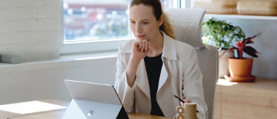 A women looking into laptop screen.