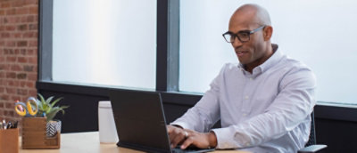 A man working in a laptop.