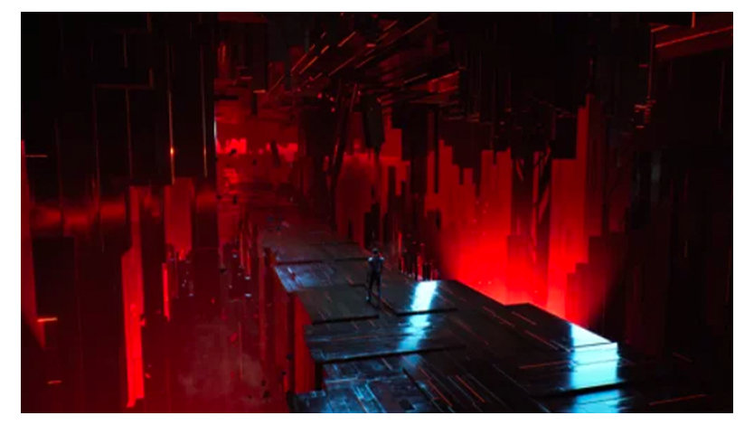 A silhouette walks down a narrow pathway, illuminated by red light.