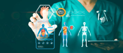 A person in scrubs holding a tablet in one hand and the other is touching an image of a heart and pulling up a detailed diagram of the human body organs and skeletal frame with options to select for more information.
