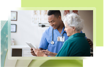 A doctor and a patient looking at a tablet.