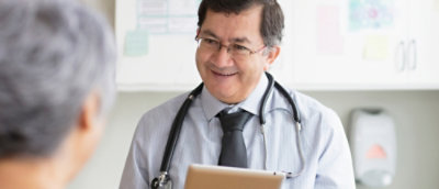 A man wearing glasses and a tie.