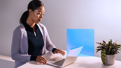 A woman using a laptop.