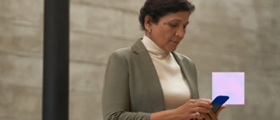 Person using smartphone indoors