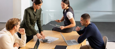 A group of people sitting around a table.