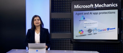 A women sitting in front of a screen where microsoft product are displaying