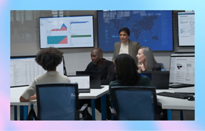 A group of 5 people discussing in office