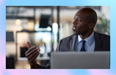 A person explaing with a laptop open