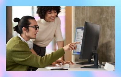 Two person looking at the desktop