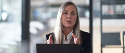 A person is sitting in front of laptop