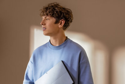 A man holding a laptop.