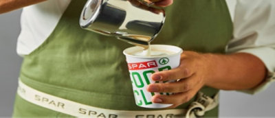 SPAR employee holding a cup