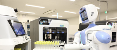 Robot interacting with laboratory automation systems.