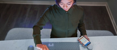 A woman looking at a computer screen.