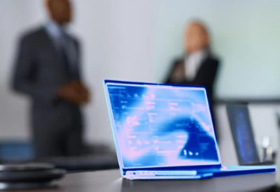 A close-up of a laptop on a table.