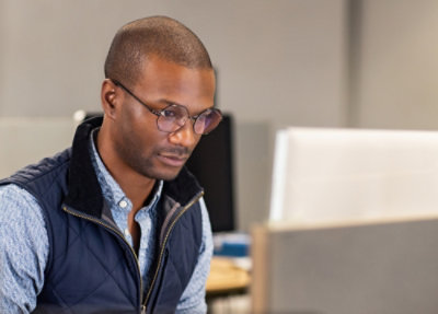 A person looking at a computer screen.