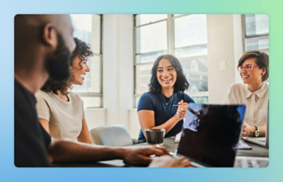 A group of people sitting around a table.