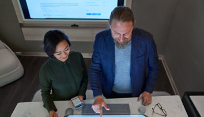 Two people looking at a computer screen