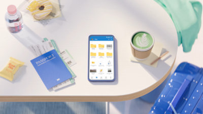 A smartphone displaying a file management app sits on a table next to a passport, boarding passes