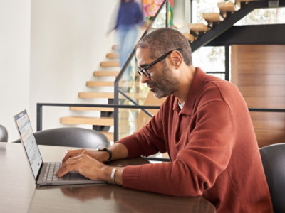 A man working on the laptop in office environment