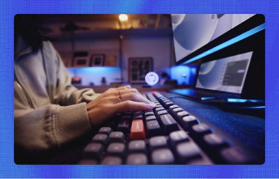 A women typing on a keyboard.
