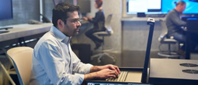 A person working on laptop in office