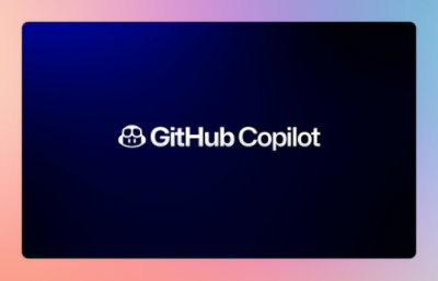 A man wearing cap looking at a computer.