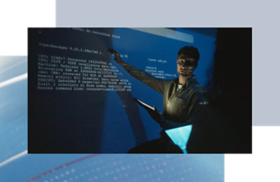 Person presenting technical information while pointing to code projected on a large screen. Provide your feedback on BizChat