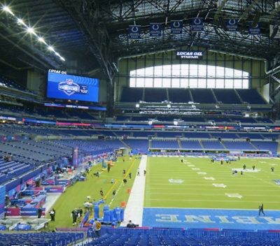 A football field with people in the stands.