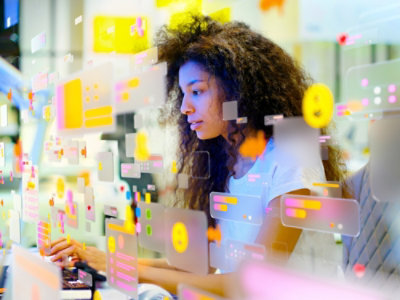 A person using a computer and looking at the screen.