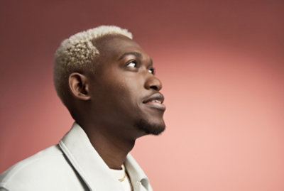 A close-up of a person's neck and face looking upward to the side.