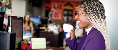 A person drinking from a cup.