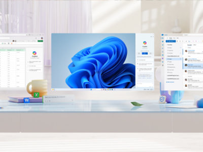 A desk with a computer display showing a spreadsheet and a Windows wallpaper, a mug, a phone, a mouse, and Microsoft Word