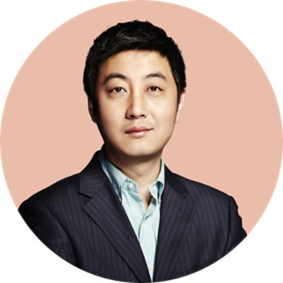 A close-up of a person wearing a suit.