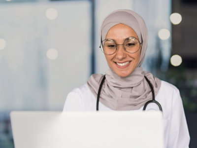 Two people looking at a skeleton