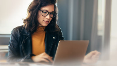 A woman working on a laptop