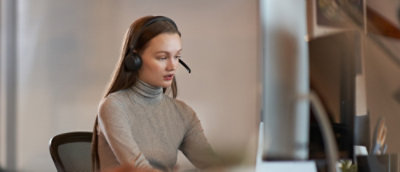 A woman wearing a headset.