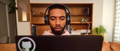 A man working on a laptop.