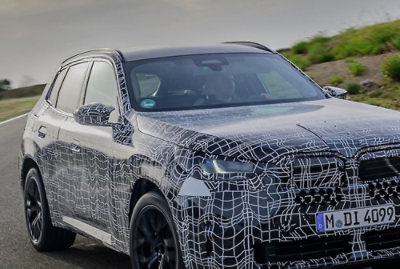 A close-up of a car with a spider web pattern and the text M.DI 4099.