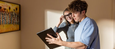 Two people discussing while looking at the laptop