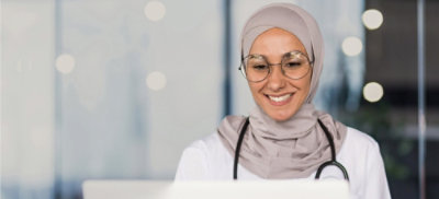 A stethoscope around her neck, indicating she is likely a doctor.