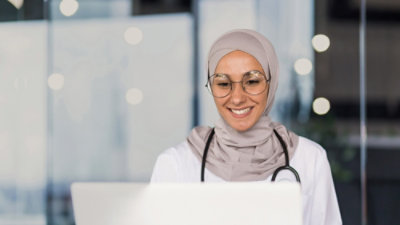 A doctor looking at the screen.