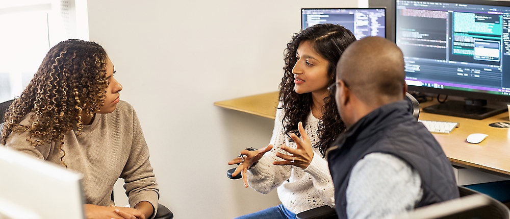 A group of people discussing at a table.