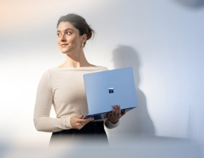 A women holding a laptop
