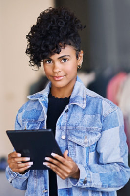 A person holding a tablet.