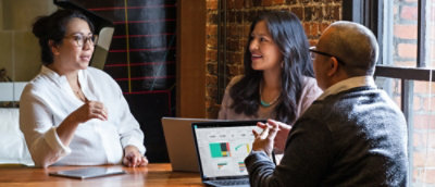 A group of people sitting at a table.