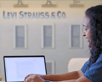 A women working on a laptop.