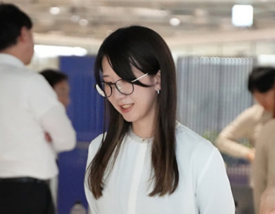 Person with glasses in office workspace